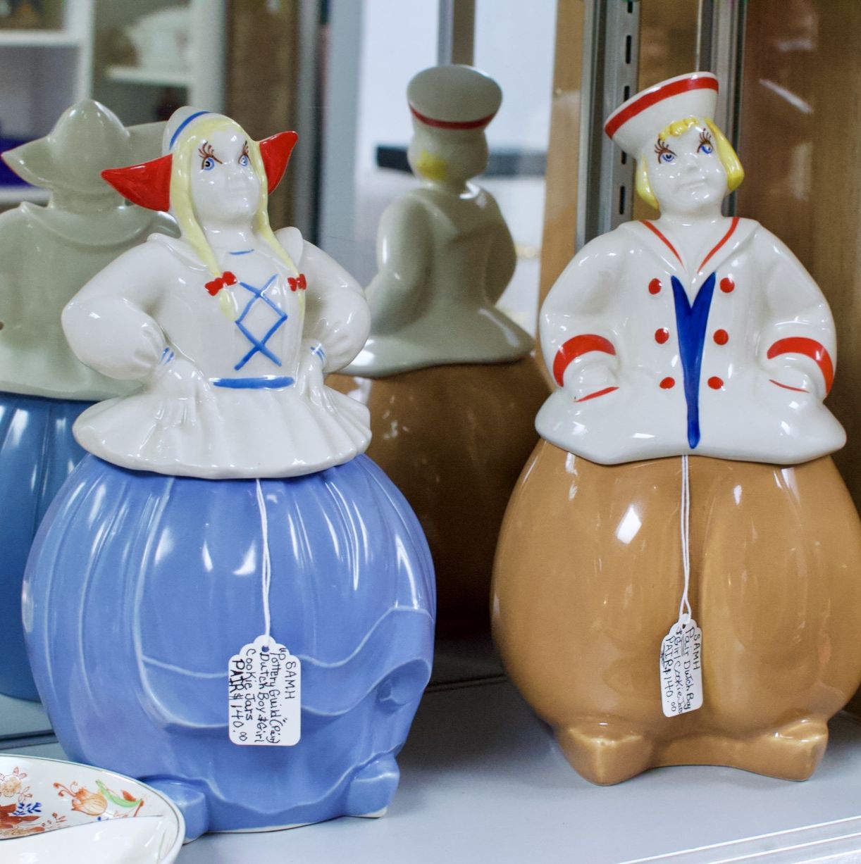 Pottery Guild pair of Dutch boy & girl cookie jars