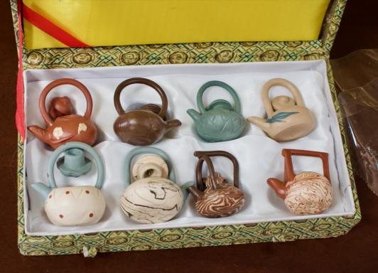 8 mini teapots