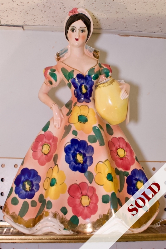 Large figurine in floral dress