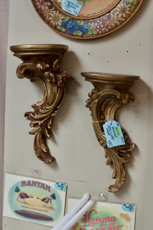 Gold leaf demi-lune shelves