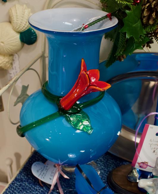 Blue hand blown vase w/ red flower