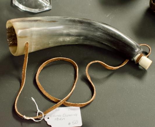 Viking blowing horn