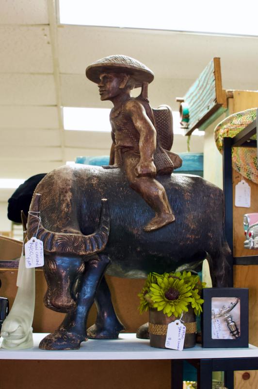 Hand carved man on water buffalo