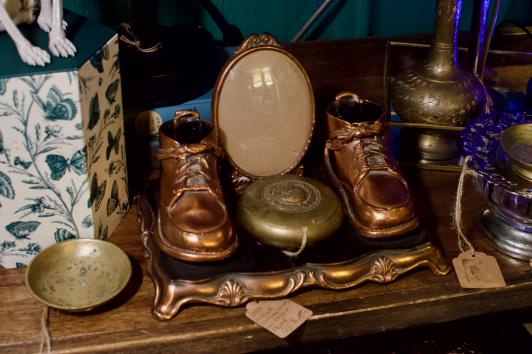 Antique bronzed shoes w/ convex frame
